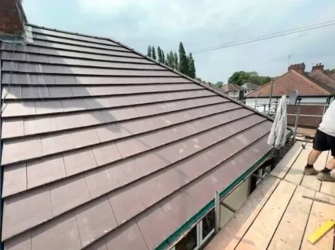 Brown tiled pitched roof installation